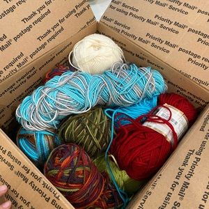 Full to the brim box of yarn, some new some used